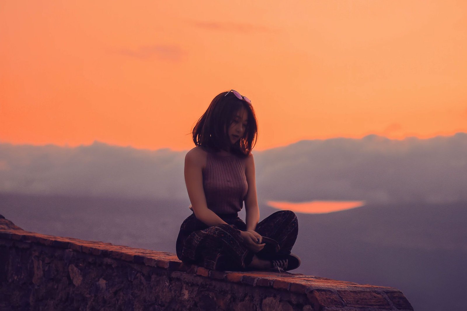 Woman sitting on a Wall Woman sitting on a Wall